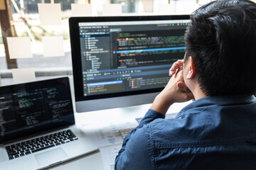 Developer programmer working on project in software development computer in IT company office,...