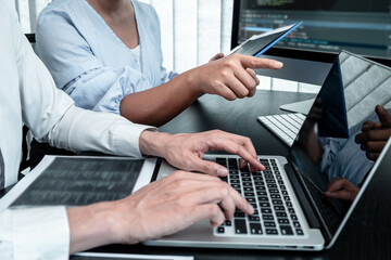 Team of Developer programmer working on coding program software computer in office, Writing website...