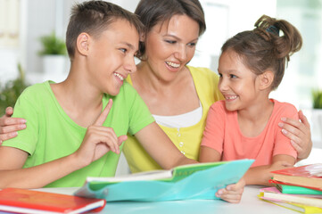 Portrait of brother and sister doing homework together