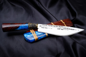knife custom or Enep in the natural wood scabbard on old table background handmade of Thailand