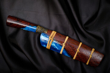 knife custom or Enep in the natural wood scabbard on old table background handmade of Thailand