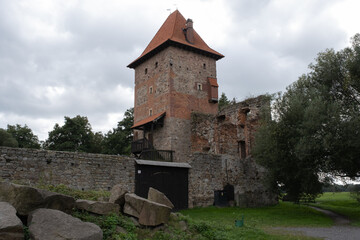 Fototapeta na wymiar Chudow, Poland - September 24, 2021. Chudow Castle is an example of a 16th-century noble residence with defensive qualities (location in wetlands, massive walls, moat). Selective focus.
