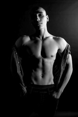 Fototapeta premium The muscular egyptian male on black background. Sexy naked torso. Sport workout bodybuilding concep. Muscular torso and chest. Isolated on black background.