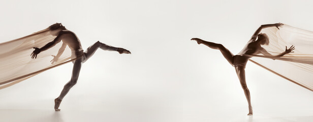 Modern ballet dancers. Contemporary art. Young flexible athletic man and woman in tights. Concept...