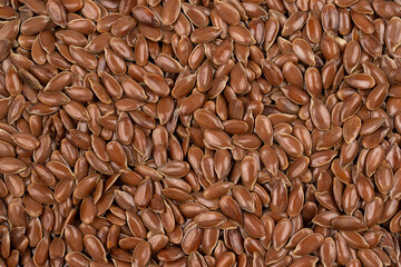 Brown flax seed background. Flax seed is a good source of omega-3 fatty acids