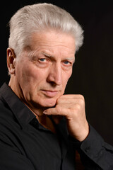 Close up portrait of thoughtful senior man