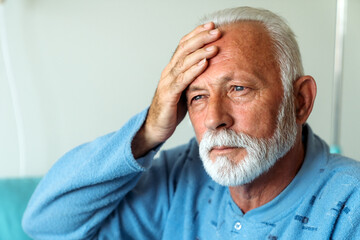 Fototapeta premium Senior man suffering from headache. Healthcare illness people concept