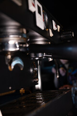 Fototapeta na wymiar close up of a professional coffee machine. loft dark coffee shop
