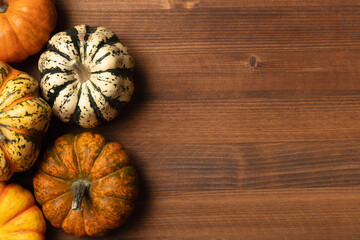 Miniature pumpkins background for Thanksgiving or Autumn.