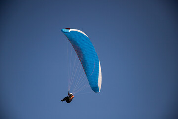 glider paragliding g against blue sky flying  adrenaline and freedom concept