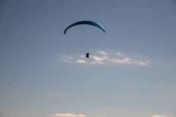 glider paragliding g against blue sky flying  adrenaline and freedom concept