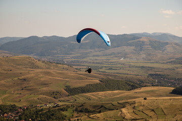 glider paragliding g against blue sky flying  adrenaline and freedom concept