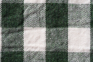 Close-up of dark green checkered cotton fabric