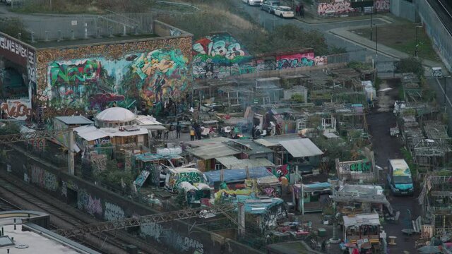 An outdoor party in a commune compound in London