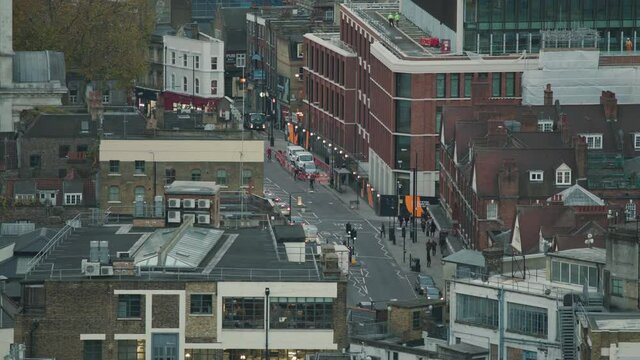 People and cars move on the street in a time lapse in London