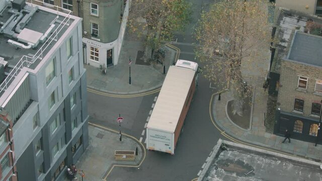High angle shot of people and cars moving through London during the day. time lapse.