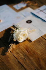 wedding rings and white wedding rose corsage bouquet