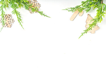 Christmas new year background with handmade wooden eco fir tree decorations, top view