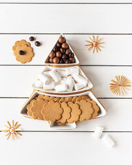 Sweet treats on a Christmas-tree-shaped sectional plate
