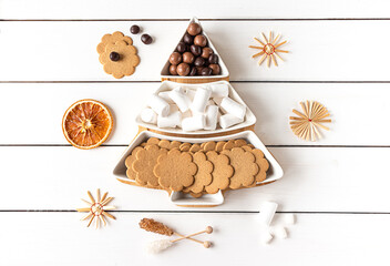 Sweet treats on a Christmas-tree-shaped sectional plate