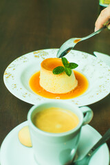 presentation of restaurant menu, homemade flan dessert with coffee