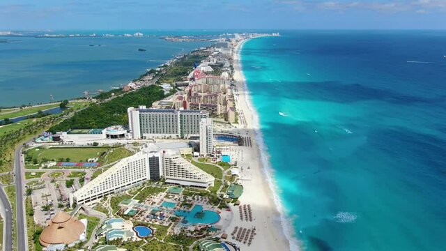 Caribbean white unspoiled sandy beach aerial drone view. Flying over Cancun bay in Yucat&aacute;n Peninsula in the Mexican state of Quintana Roo. Tourist hotel resort complex on paradisiacal beaches. White 