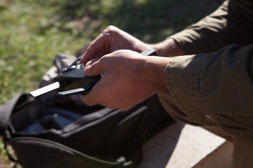 a man controls the drone's remote control