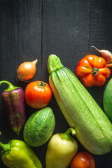Big set of fresh vegetables for a salad diet on a vintage table. Cooking salad in the restaurant kitchen. Free ad space