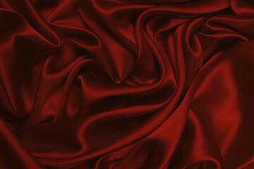Fototapeta premium Rich and luxury red silk fabric texture background.