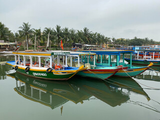 Fototapeta na wymiar Tourist boats docking in Hoi An, Vietnam