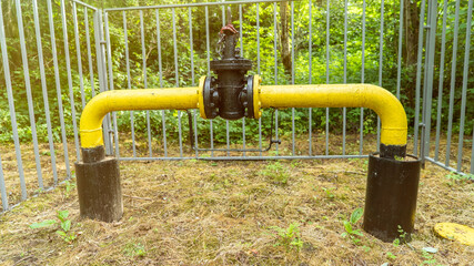 Gas industry. The locking device of the gas pipeline passing in the wood and brought outside,...