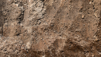 Texture layers of earth. Cross section of brown underground soil layers beneath. Natural cut of...