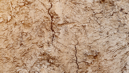 Texture layers of earth. Cross section of brown underground soil layers beneath. Natural cut of soil with different layers