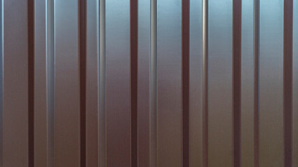 Corrugated metal sheet texture background. Texture of brown metal profiled sheet fence decking....