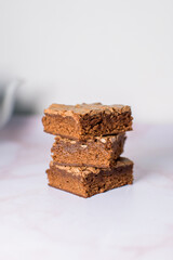 closeup of tower of brownie cake slices ready to eat in the afternoon