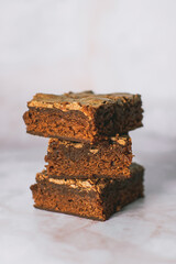 closeup of tower of brownie cake slices ready to eat in the afternoon