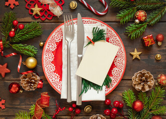 Festive table setting of with fir tree branches and Christmas decorations