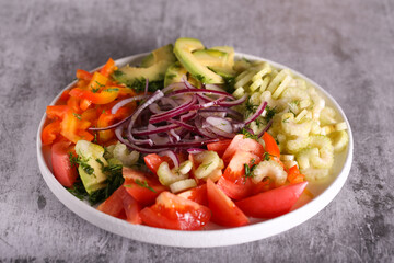 fresh salad of celery tomatoes avocado onions and herbs