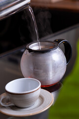 glass tea pot filled whit red tea