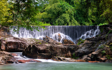 Waterfall in the beautiful deep forest of Thailand.