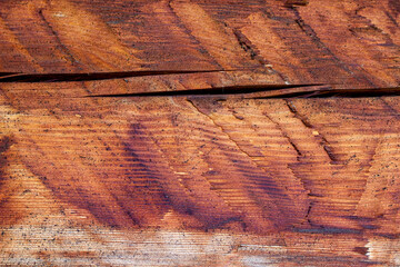 An old board with a visible crack. Wooden background