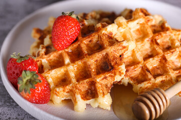 viennese cottage cheese waffles with honey and strawberries