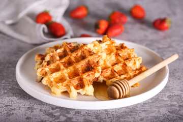 viennese cottage cheese waffles with honey and strawberries