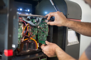 Close up of electrician engineer works with electric cable wires