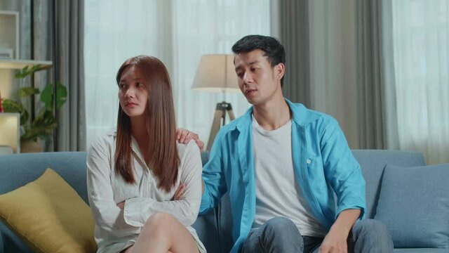 Young Asian Husband Asking Forgiveness, Making Peace With Offended Annoyed Wife After Quarrel Or Cheating, Young Woman Ignoring Man, Not Talking, Family Crisis, Relationship Problem, Break Up And Divo