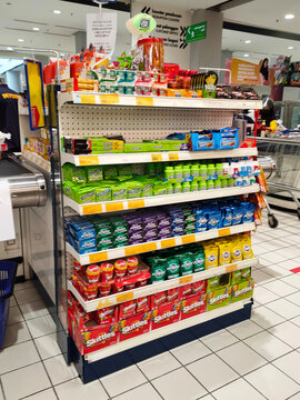 PENANG, MALAYSIA -JULY 7, 2021: Selected focused on the chewing gum arranged neatly on the shelves in the store. Marked with a price tag and sorted by brand.