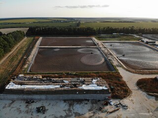 Basin or tank sedimentation tanks. Aerial top view of round polls in wastewater treatment plant,...