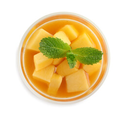 Delicious mango jelly with fresh fruit pieces and mint isolated on white, top view
