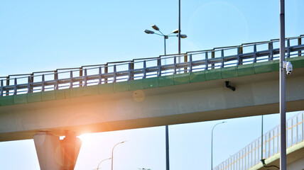 Bridge against the blue sky. Motorway flyover. Elevated roads on sunny day.
