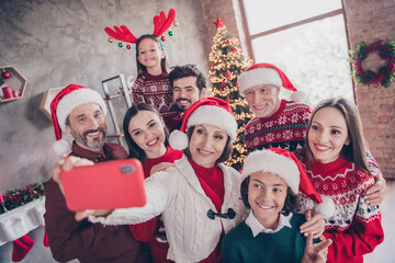 Photo of little small preteen school wife husband retired pensioner married people xmas santa claus hat make selfie phone indoors